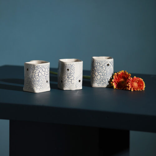 Blossom Tealight Holders by Sarah McKenna Ceramics with orange gerberas